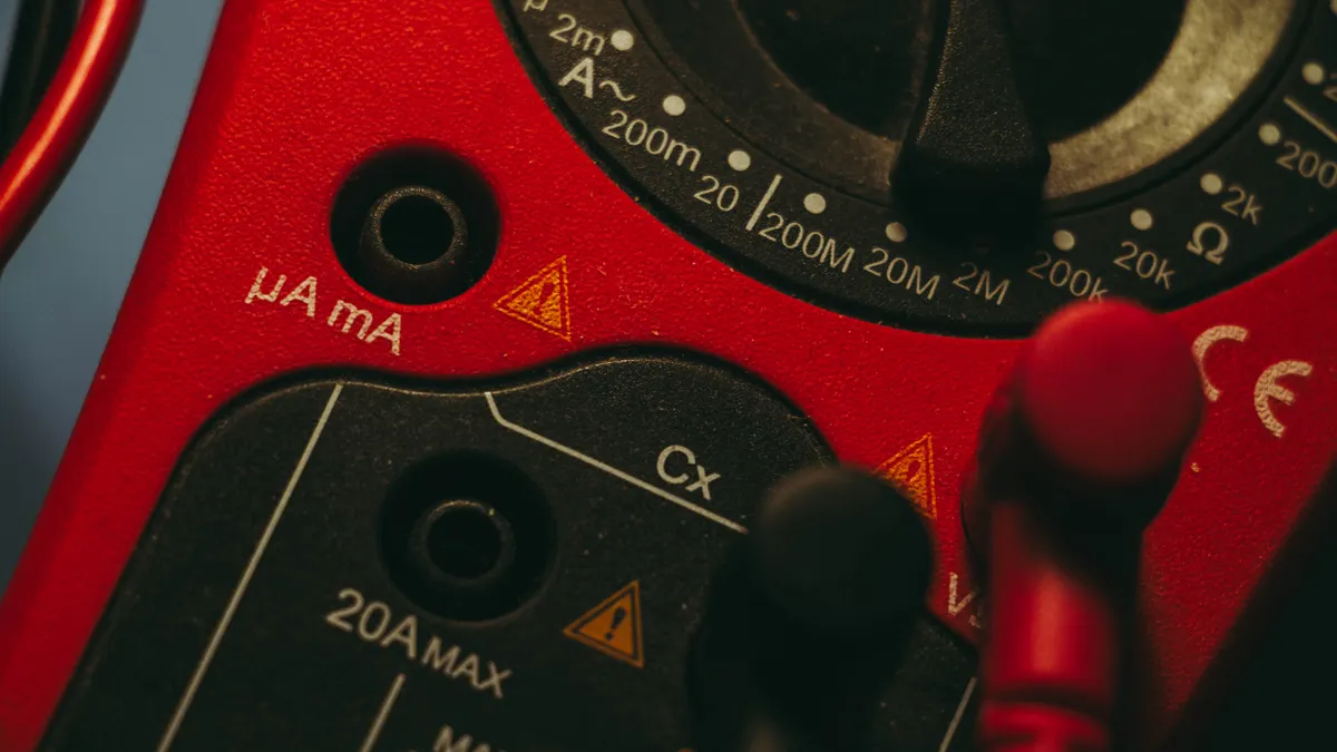 Close-up of a digital multimeter dial and probes